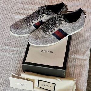 Gucci women’s Silver Glitter Sneakers with Red and Blue Stripes